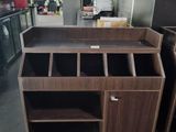 a kitchen island with drawers and cabinets in the middle of the room