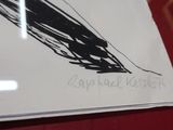 a black and white drawing of a bird on a piece of paper