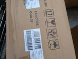 a cardboard box that is sitting on top of a pile of boxes
