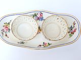 two bowls and a plate on a white table