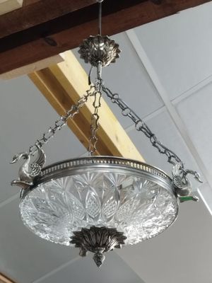a chandelier hanging from the ceiling in a room