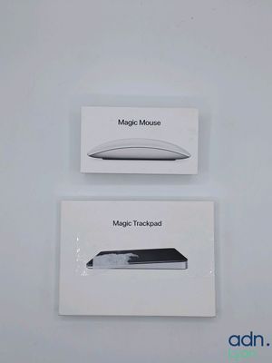 two boxes of apple magic mouses sitting on top of each other