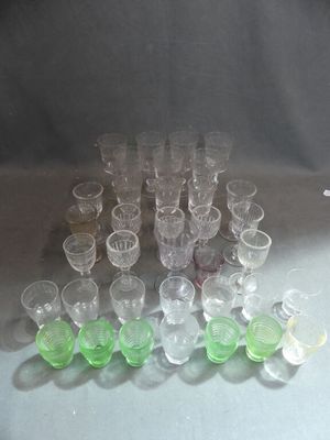 a lot of glasses that are sitting on a table