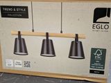 three lights that are hanging from a wooden pole