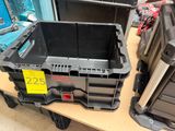 a black plastic box with a yellow tag on it