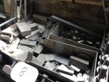 a pile of metal items in a metal container