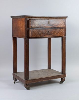 an old wooden table with a drawer on top of it
