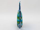 a glass vase with a blue and green design on it