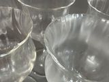 many empty wine glasses sitting on a tray