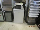 a small refrigerator and a microwave in a store