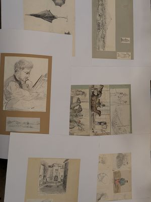 a lot of drawings on the wall of this room