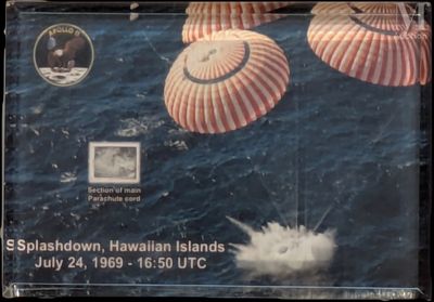 three parachutes that are being flown over the water