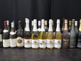 many bottles of wine lined up on a table