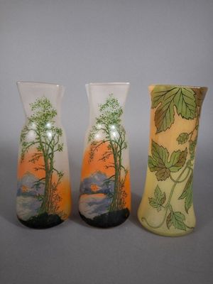 three vases sitting next to each other on a table