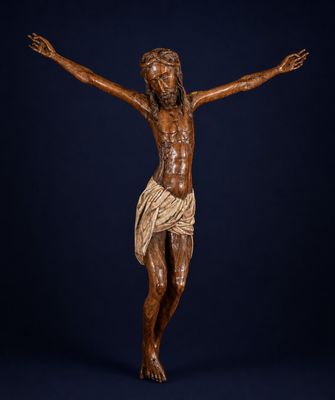 a wooden statue of jesus on the cross