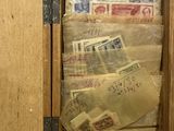a wooden cabinet with a bunch of mail inside of it