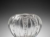 a glass vase that is sitting on a table