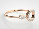 a close up view of a rose gold ring with diamonds