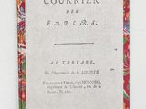 a close up of a book on a white surface with a red border