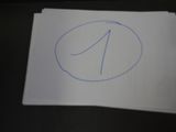 a piece of paper with a blue number on it