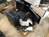 a pile of computer equipment sitting on top of a pallet