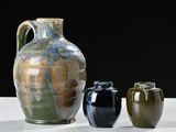 three vases sitting next to each other on a table