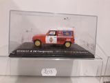 a red and white truck in a glass case