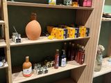 a wooden shelf with jars and jars on it