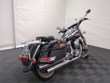 a black motorcycle that is parked in a room