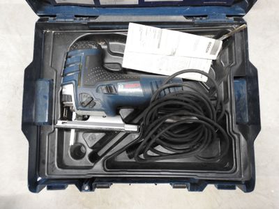 a tool in a case with a cord and a cord