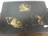 a picture of a table with a black and gold table cloth on top of it