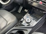 a car dashboard with a control panel and a steering wheel
