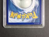 a close up of a pokemon trading card on a table