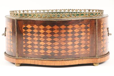 a small wooden box with a checkered pattern on it