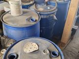 many barrels that are sitting in a garage
