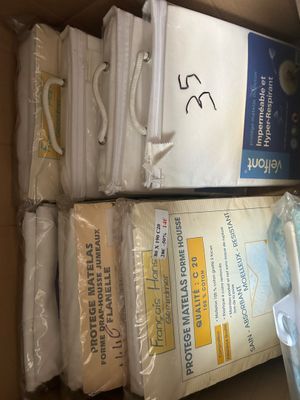 a box full of white towels and other items in it