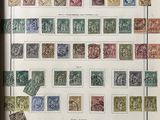a framed picture of a collection of stamps on a wall
