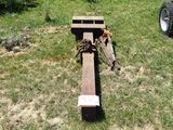 a wooden cross that is laying in the grass