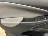 a close up of a car door handle with buttons
