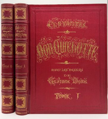 un livre rouge orné de lettres dorées, avec deux livres devant