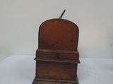 a small wooden box with a bird on top of it