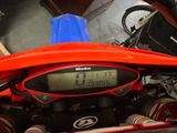 a close up of a motorcycle with a digital clock on it