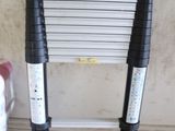 two ladders sitting next to each other on the floor