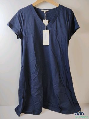 an image of a women ' s t - shirt hanging on a hanger