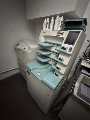 an image of a hospital room with a washing machine and other medical equipment
