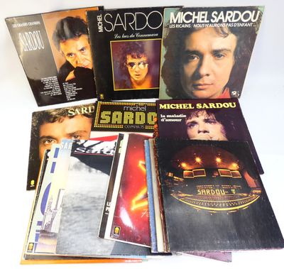 the album covers of michael sardou ' s album are stacked on top of each other