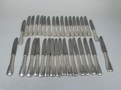 an assortment of silverware including knives, knives, and spoons