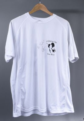 a white t shirt with a black and white drawing of a dog on it