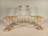 a group of glasses and a decanter on a table