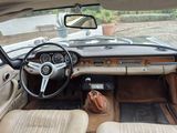 a view of the interior of a car from the driver ' s seat
